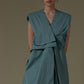 SLEEVELESS DRESS WITH ASYMMETRICAL FRONT PLEAT AND SHOULDER PADS
